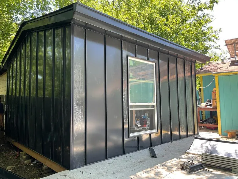 Black standing seam metal wall panels for Roof Inspection in Bigfork