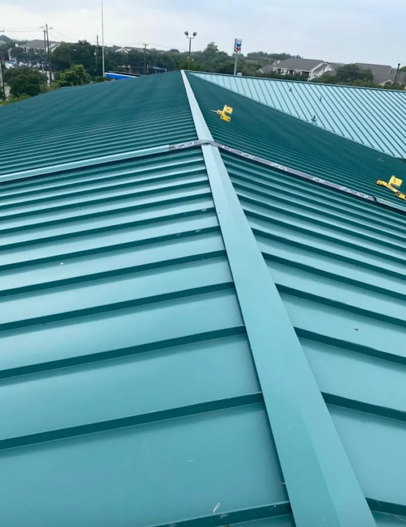 Green commercial metal roof ridge and valley for Metal Roof Repair in Bigfork